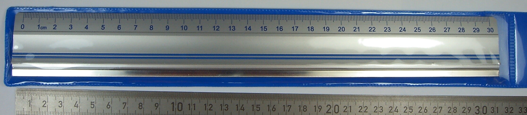1 Schneidelineal, Alu mit Stahlkante. 300mm. Mit